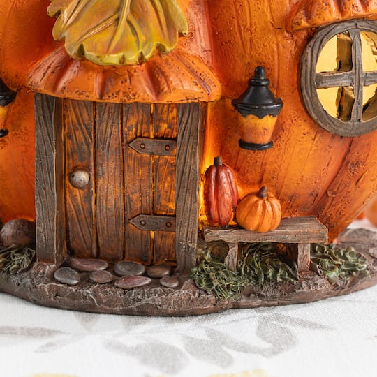 Glitzhome® 8.5" Lighted Fall Resin Pumpkin House Table Decor with Timer
